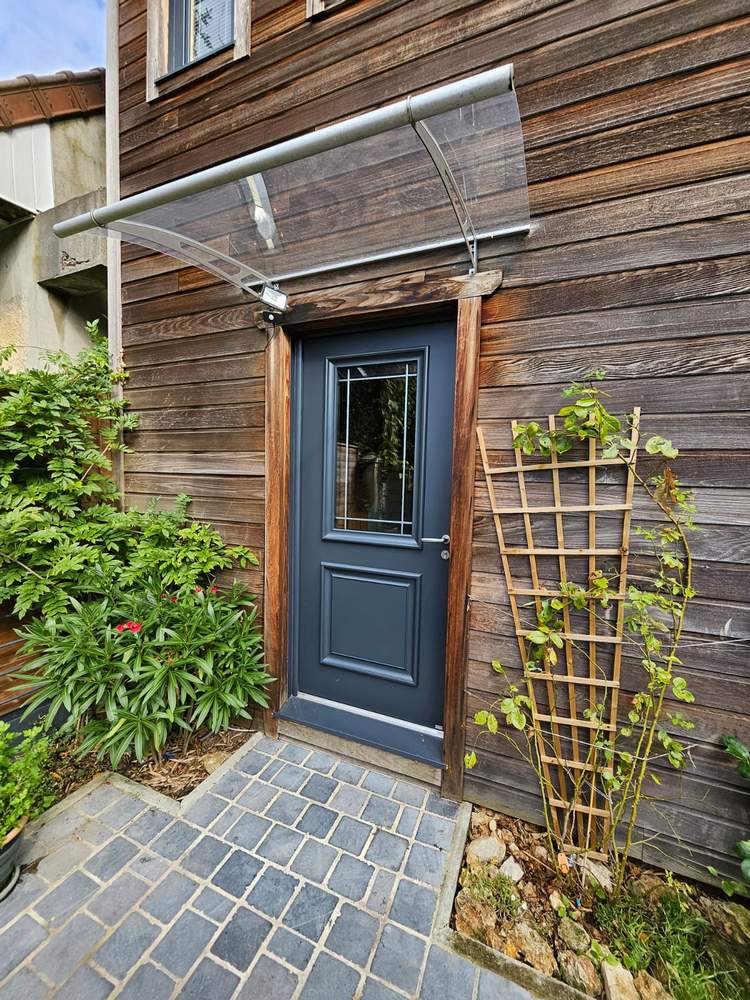 Réalisation à Franconville : Installation d’une Porte d’Entrée BEL’M – Modèle Isaac en Mixte Bois & Aluminium Réalisation à Franconville : Installation d’une Porte d’Entrée BEL'M – Modèle Isaac en Mixte Bois & Aluminium